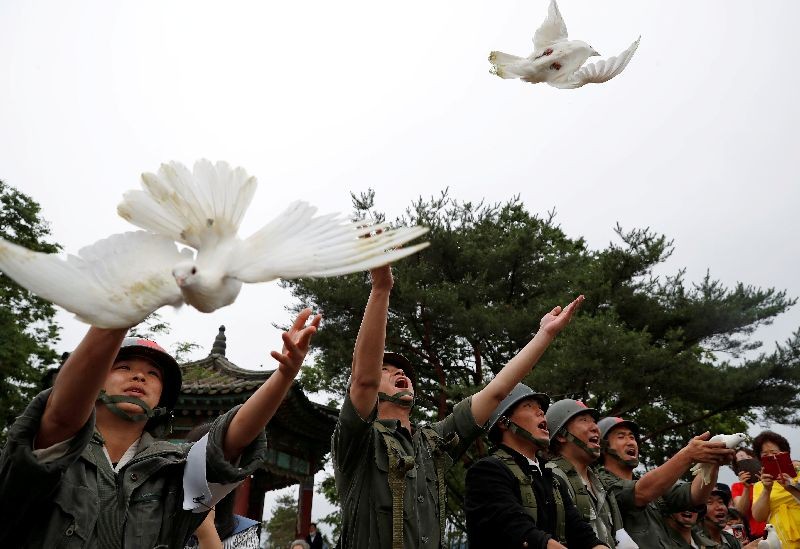 Doves are released during a ceremony commemorating the 70th anniversary of the Korean War, near the demilitarized zone separating the two Koreas, in Cheorwon, South Korea, June 25, 2020. REUTERS/Kim Hong-Ji